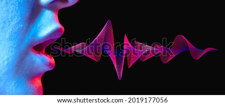 Woman lips with sound wave on black background in neon light.