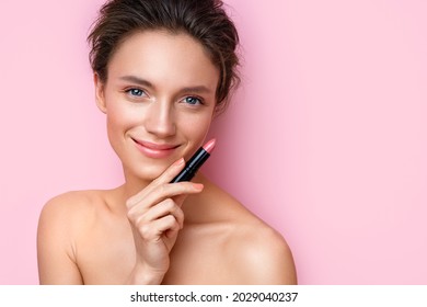 Woman with lipstick. Photo of woman with perfect makeup on pink background. Beauty concept