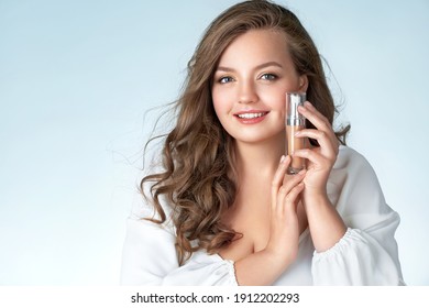 Woman With Liquid Foundation. Photo Of Woman With Perfect Makeup On Light Blue Background. Beauty And Skin Care Concept. Plus Size Model.