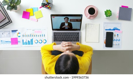 Woman Listen Management Forum Town Hall Meeting Reskill Upskill Seminar Videocall Learn At Home Office Desk In Quarantine Social Distance. Chinese Lady Hispanic Female Watch Company Consult Screen.