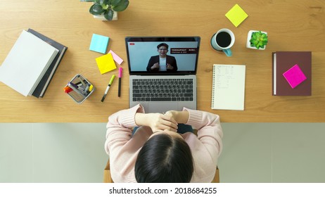 Woman Listen Management Forum Town Hall Meeting Reskill Upskill Seminar Videocall Learn At Home Office Desk In Quarantine Social Distance. Chinese Lady Hispanic Female Watch Company Consult Screen.