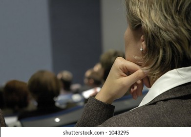 Woman listening during conference