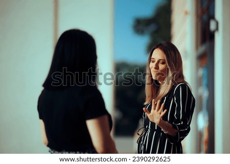 
Woman Listening to her Friend Lies Making Stop Gesture
Girl not trusting her manipulative best friend blocking communication 
