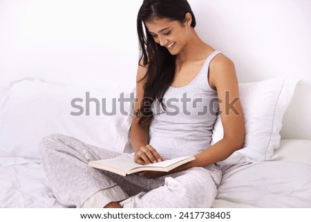 Woman, literature and relaxing by reading a book in bed, knowledge and fictional novel at home. Happy female person, education and story for learning or fantasy, bedroom and hobby in morning routine