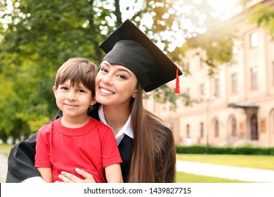 Woman With Little Son On Her Graduation Day