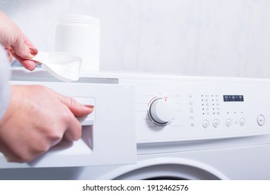 Woman Load A Washing Powder To The Washing Machine From Box, Close Up.