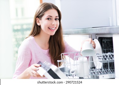 Woman Loading Dishwasher
