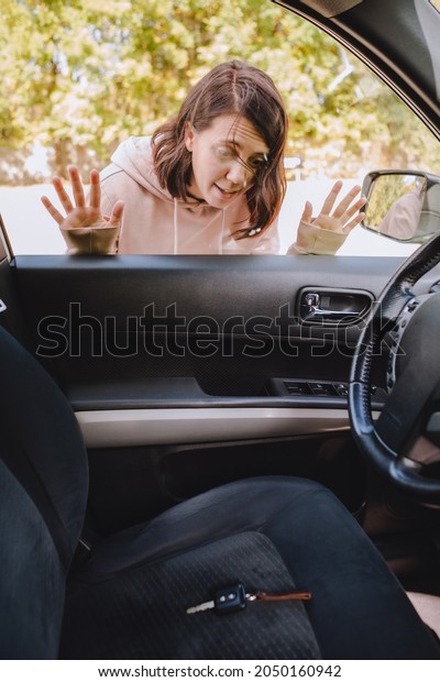 woman\
locked car and forget keys inside. copy\
space