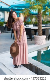 Woman In The Long Dress Relaxing In The Summer City