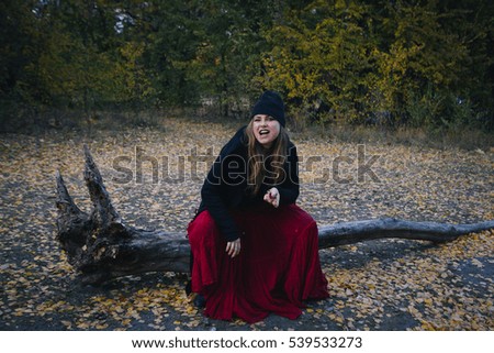 Similar – Young, tall woman sits in a summer dress on the beach of the Baltic Sea and smiles