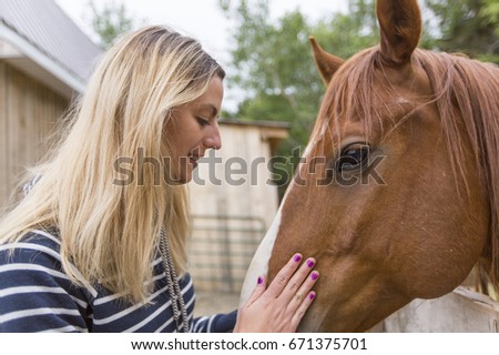 A woman long hair with beautiful horse