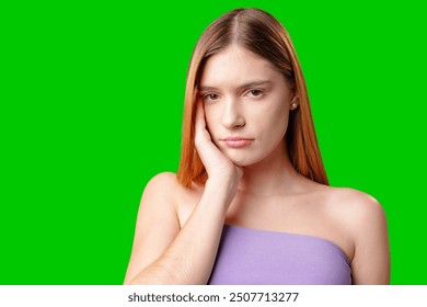 Woman With Long Hair Contemplating While Posing Against a Green Screen - Powered by Shutterstock