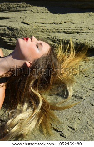 Similar – Image, Stock Photo Young woman at the stand blond hair blows around her