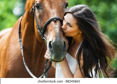 woman long hair kissing beautiful horse - Powered by Shutterstock