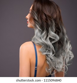 Woman With Long Healthy Colorful Ombre Grey Wavy Hair. Close Up Of Hairstyle. Care And Hair Products