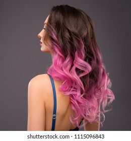 Woman With Long Healthy Colorful Ombre Pink Wavy Hair. Close Up Of Hairstyle. Care And Hair Products