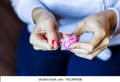 Woman With Long Red Nails Removing Nail Polish At Home, Close Up Photo