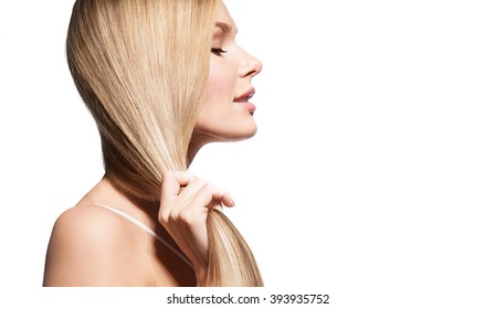 Woman With Long Thick Straight Hair On A White Background In Profile