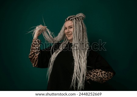 Woman With Long White Hair and Leopard Print Sleeve