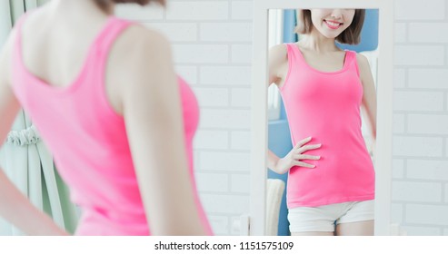 Woman Look Mirror And Show Her Slim Waist To You