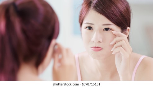 Woman Look Mirror And Touch Her Eyes In The Bath Room