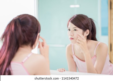 Woman Look Mirror And Touch Her Eyes In The Bath Room