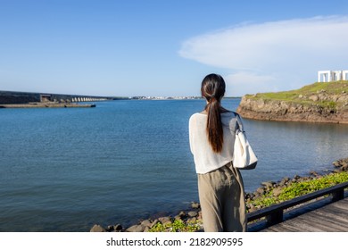 Woman look at the sea view in Penghu of Taiwan