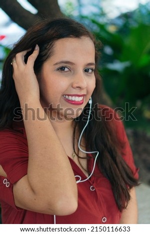 woman looking at the camera in a park