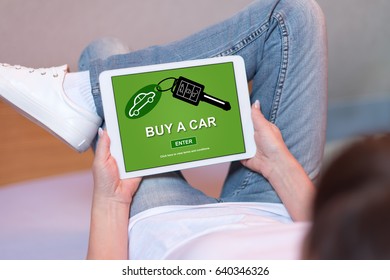 Woman Looking At Car Sale Concept On A Tablet