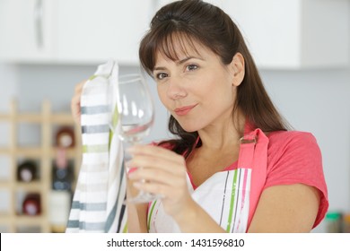 Woman Looking At Clean Glass