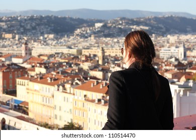 Woman Looking Down At The City Of Nice In South Of France