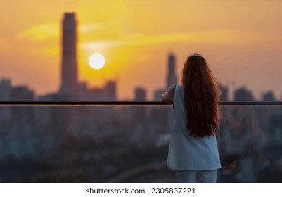 Woman looking and enjoying sunset view from balcony with the sun setting behind skyscraper in busy urban downtown with loneliness for solitude, loneliness and dreaming of freedom lifestyle