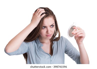 Woman Looking At The First Grey Hair On Her Scalp