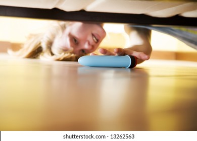 Woman Looking For Her Dildo Under The Bed