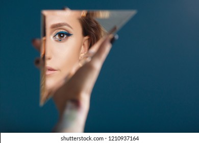 Woman Looking At Her Self Reflected In A Mirror, Selfie, Vanity, Conceit, Ego, Digital Narcissism Concept Minimal Flat Design. An Illusion, Beautiful Girl With A Mirror In Her Hands