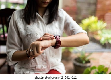 Woman Looking At Her Smart Watch