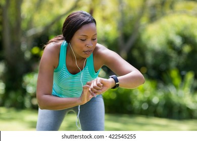 Woman Looking Her Watch At Park