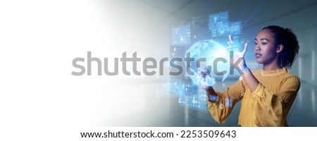 Woman looking at hologram. Wide angle visual for banners or advertisements.