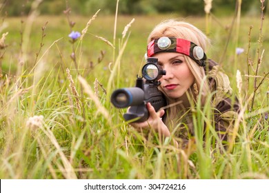 Woman looking into the optical sight