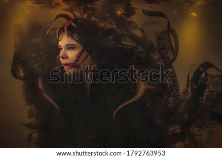 Woman looking like a female underwater creature with antlers, wearing a costume made of film strips floating around in the dark and dirty water