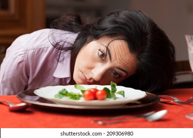 Woman Looking To A Little Salad Is Tired About Diet.