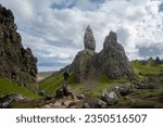 Woman looking at the massive rock formations in front of her