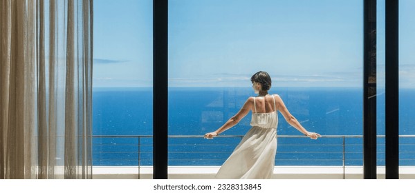 Woman looking at ocean from balcony - Powered by Shutterstock