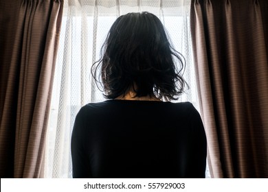 Woman Looking At The Outside