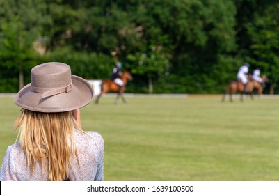 Woman looking at a polo game