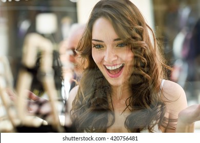 Woman Looking To Showcase Or Shop Window. Shopping Girl Chooses Shoes In Store