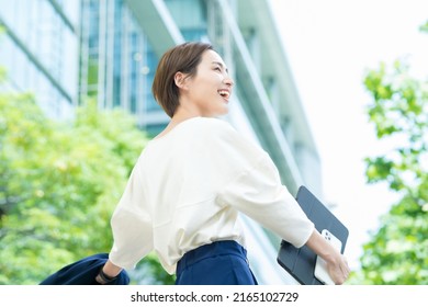 Woman looking up at the sky (business woman)
