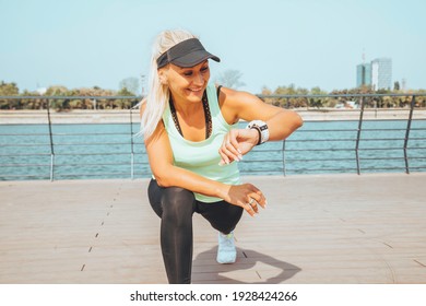 Woman Looking At Smartwatch Heart Rate Monitor. Healthy Lifestyle Concept.