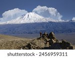 Woman looking to snowcapped Mount Ararat, Dogubayazit, Turkey