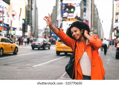 Woman looking for a taxi in New york city